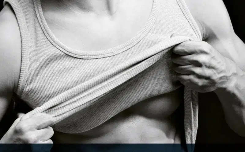 Man checking his chest before gynecomastia treatment