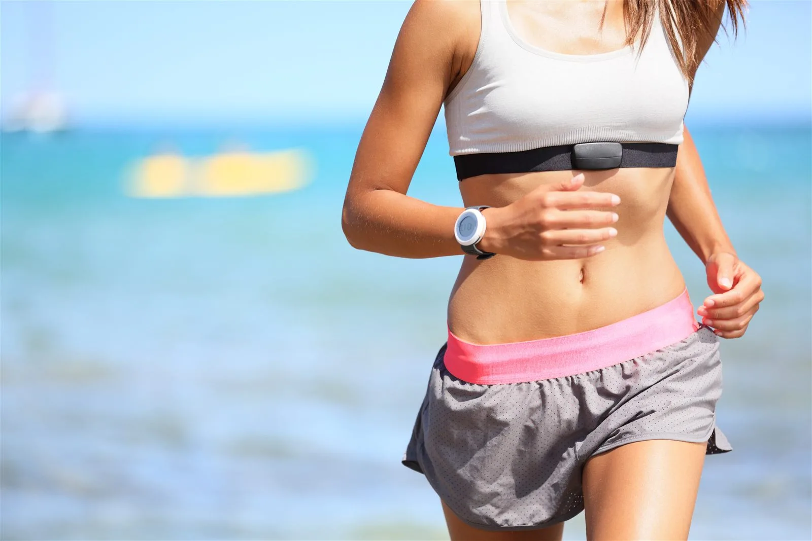 Woman brisk walking outdoors after returning to exercise